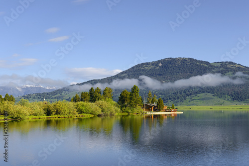 Hebgen Lake near West Yellowstone is located in Southwest Montana, is created by Hebgen Dam. Lake and the surrounding area offer many recreational activities: camping, fishing, boating, and hiking photo