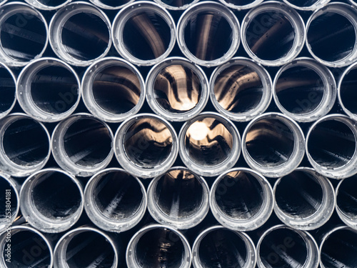 Black plastic pipes of various diameters in a row