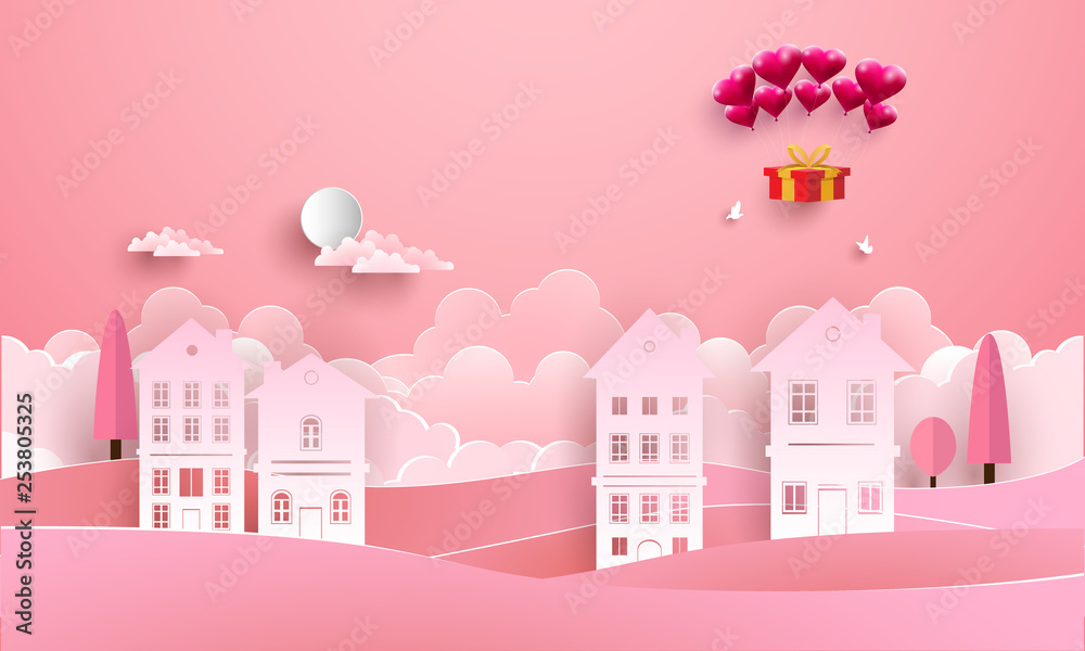 love with hot air balloon flying over the houses. paper art style love with hot air balloon flying over the houses. paper art style