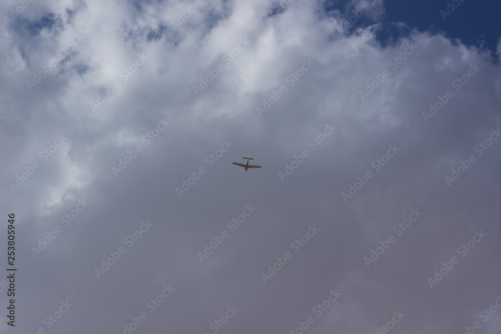 plane in sky on gray cloud background foreshortening from below flight travel concept wallpaper pattern photography with empty copy space for your text or inscription plane in sky on gray cloud background foreshortening from below flight travel concept wallpaper pattern photography with empty copy space for your text or inscription