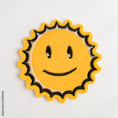 Smiling sun embroidered felt patch
