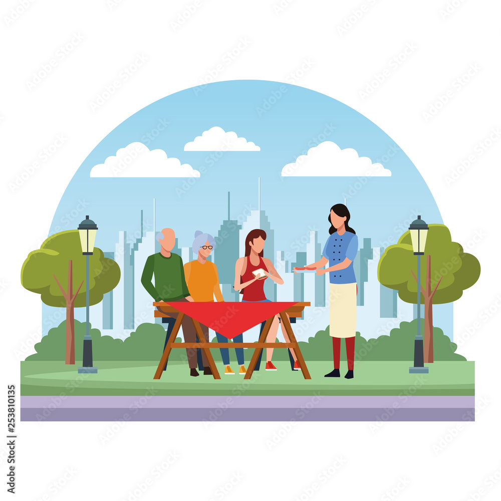 faceless family eating outdoor table