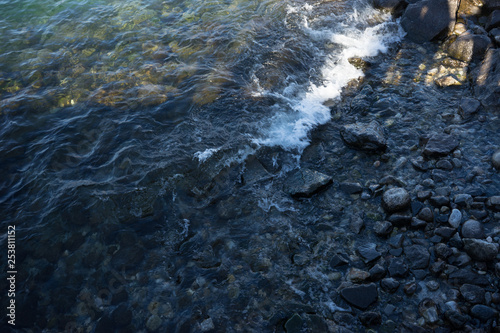 Europe  Italy  Menaggio  Lake Como  a close up of a rock next to water