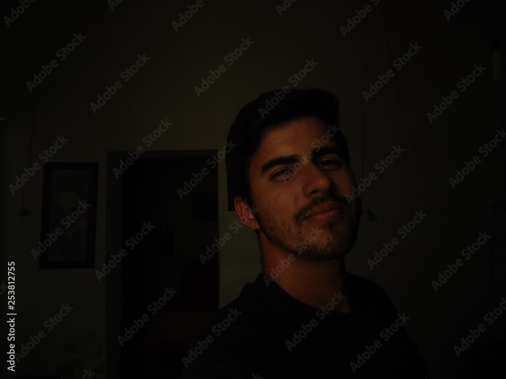 young man of arab descent wearing black shirt young man of arab descent wearing black shirt