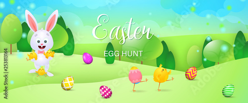Easter Egg Hunt bright banner design. Cartoon bunny hugging little chicks, eggs on grass. Illustration can be used for posters, flyers, leaflets