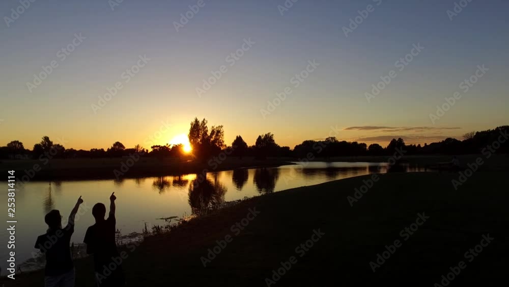 People pointing at beautiful sunset People pointing at beautiful sunset