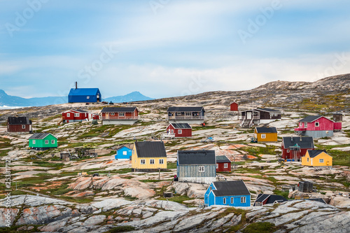 Oqaatsut village houses close to Ilulissat on the coast of Greenland photo