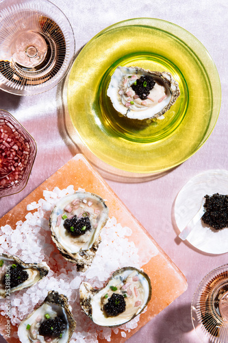 caviar on on the half shell with rose on pink velvet