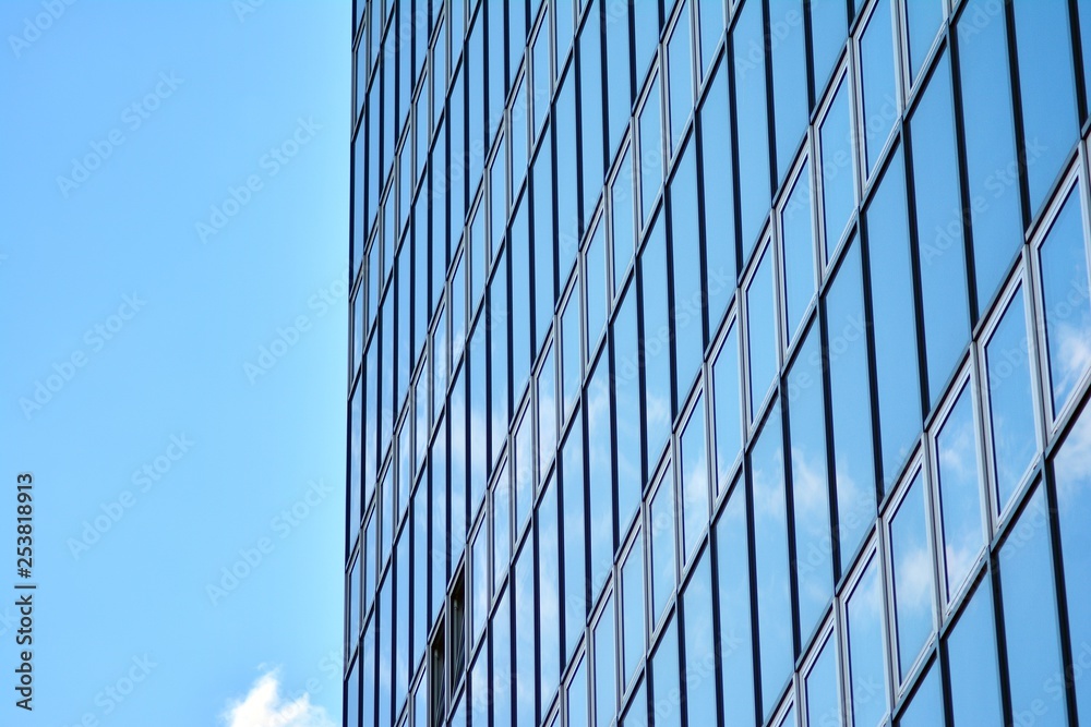Surface of glass building with the reflection of clouds Surface of glass building with the reflection of clouds