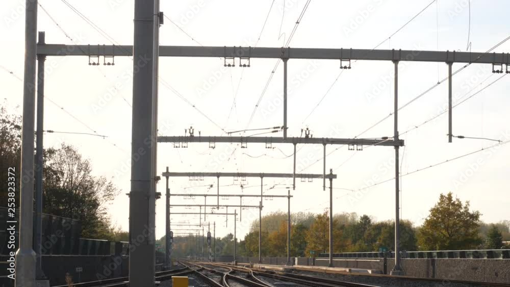 Overhead electrical wires to run and operate a public transport rail system. Tracks, ns, nederlandse spoorwegen dutch railways. Overhead electrical wires to run and operate a public transport rail system. Tracks, ns, nederlandse spoorwegen dutch railways.