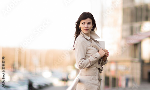 Confident business woman on a modern office building background