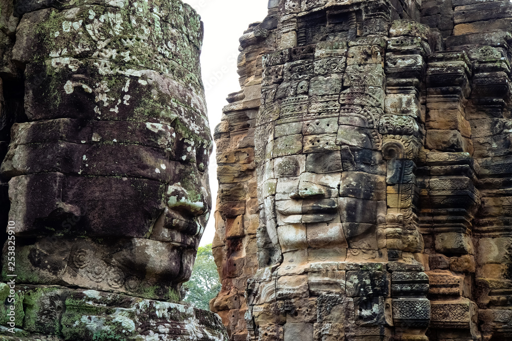 Smiling Faces of Bayon temple in Angkor Thom ancient ruin near Angkor Wat, Siem Reap, Cambodia ..One of the most magnificent lost civilization in the world. Smiling Faces of Bayon temple in Angkor Thom ancient ruin near Angkor Wat, Siem Reap, Cambodia ..One of the most magnificent lost civilization in the world.