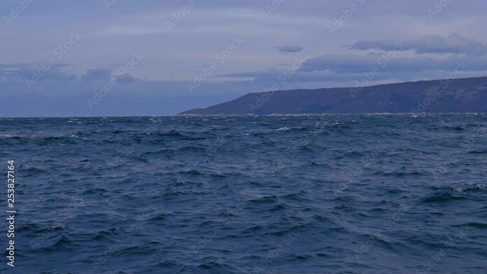 Beautiful seascape of the Adriatic sea with KRK Island on the background seen from Brestova port. Croatia. Flat plane. Slow motion Beautiful seascape of the Adriatic sea with KRK Island on the background seen from Brestova port. Croatia. Flat plane. Slow motion