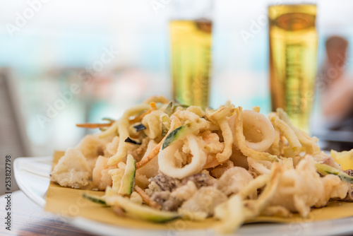 Fried mixed fish with ice-cold beer