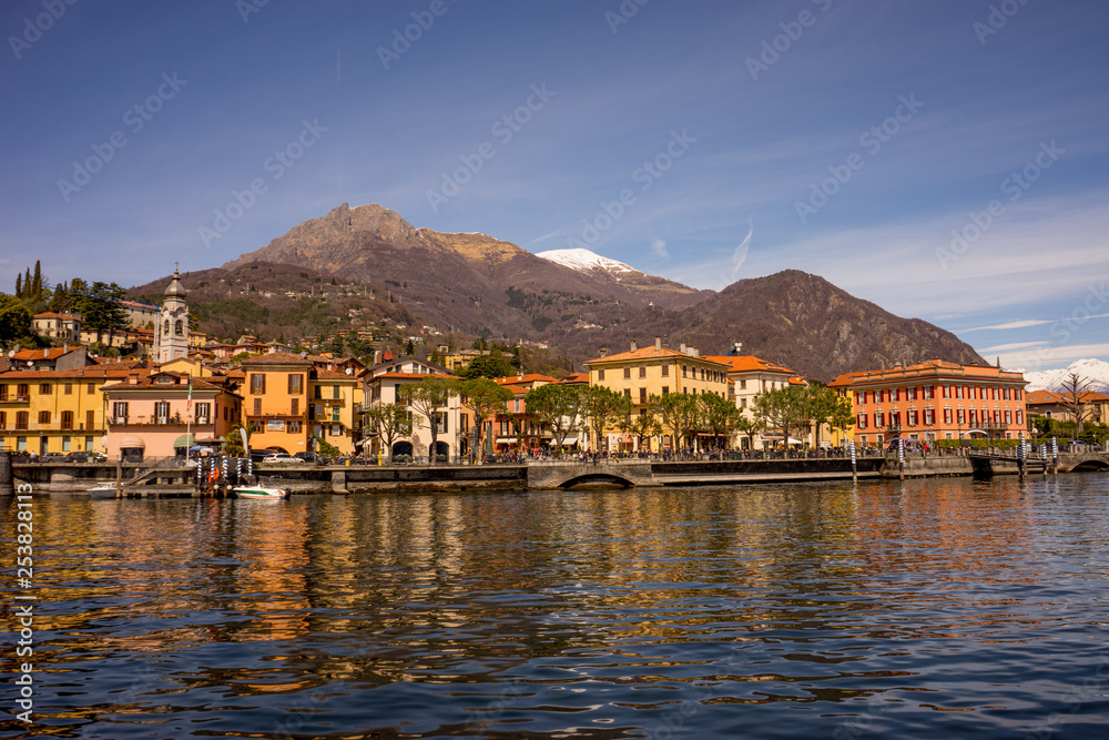 Italy, Menaggio, Lake Como, a boat is docked next to a body of water