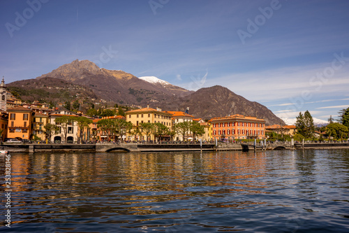 Italy, Menaggio, Lake Como, a body of water with a mountain in the background