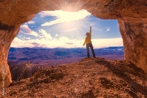 A woman in mainsails and caves, sunset