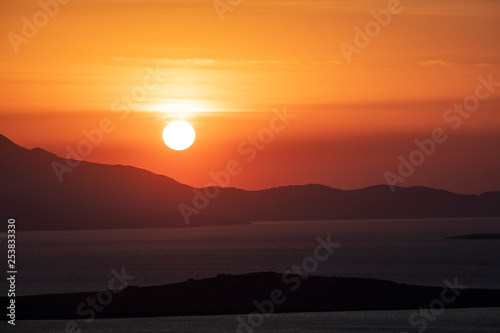 Sunset in beautiful Aagean​​ coasts. View of famous touristic place Seytan Sofrasi at sunset, Ayvalik, Turkey. photo