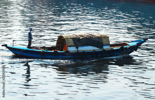 A Travel Boat Running on the Buriganga River © AbdurRouf
