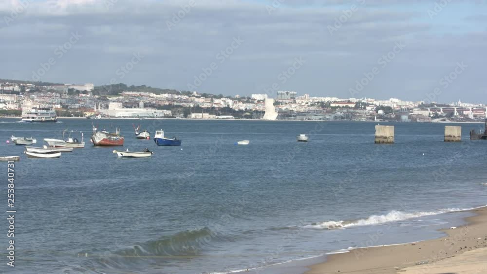 Tejo's river with view to Lisbon with a boat sailing. Moored Boats at the river bank. Shot on Ursa mini Pro 4,6k Prores 422 Tejo's river with view to Lisbon with a boat sailing. Moored Boats at the river bank. Shot on Ursa mini Pro 4,6k Prores 422