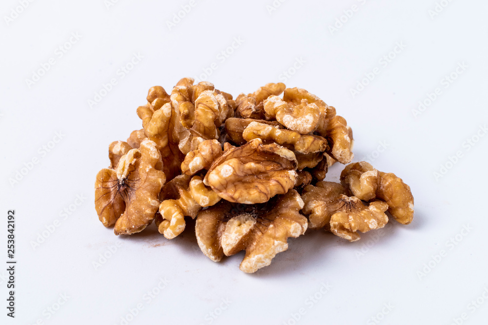 Peeled walnuts on white background. Peeled walnuts on white background.