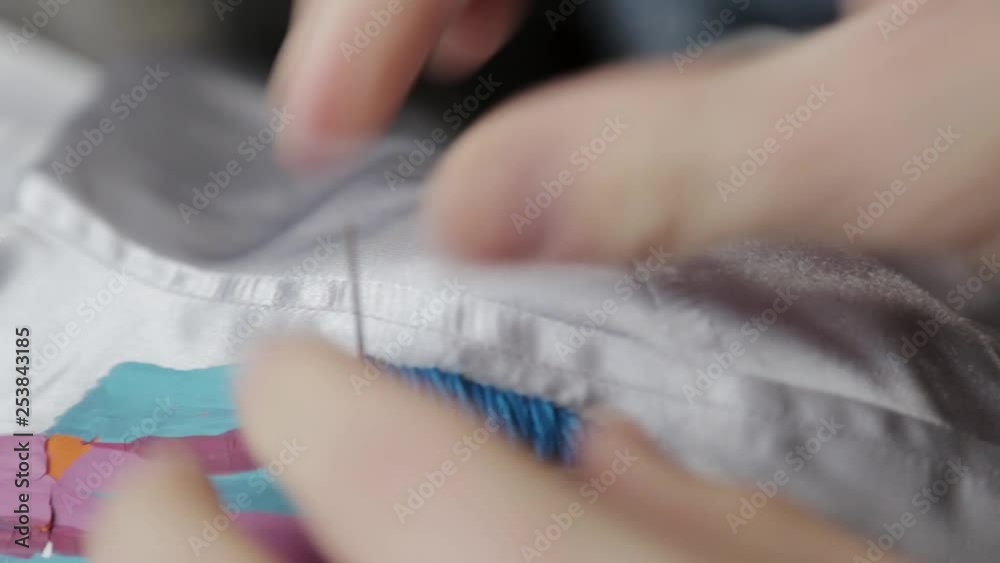 A jacket being hand embroidered. A jacket being hand embroidered.