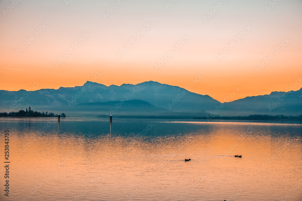 Gorgeous sunrise on the shores of the Upper Zurich Lake (Obersee) between the village of Hurden (Seedam, Schwyz) and Rapperswil (Sankt Gallen), Switzerland