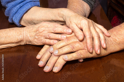 Old people holding hands. Closeup.