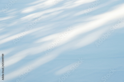 snow texture with sunlight and shadows