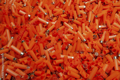 Empty orange shotgun cartridges
