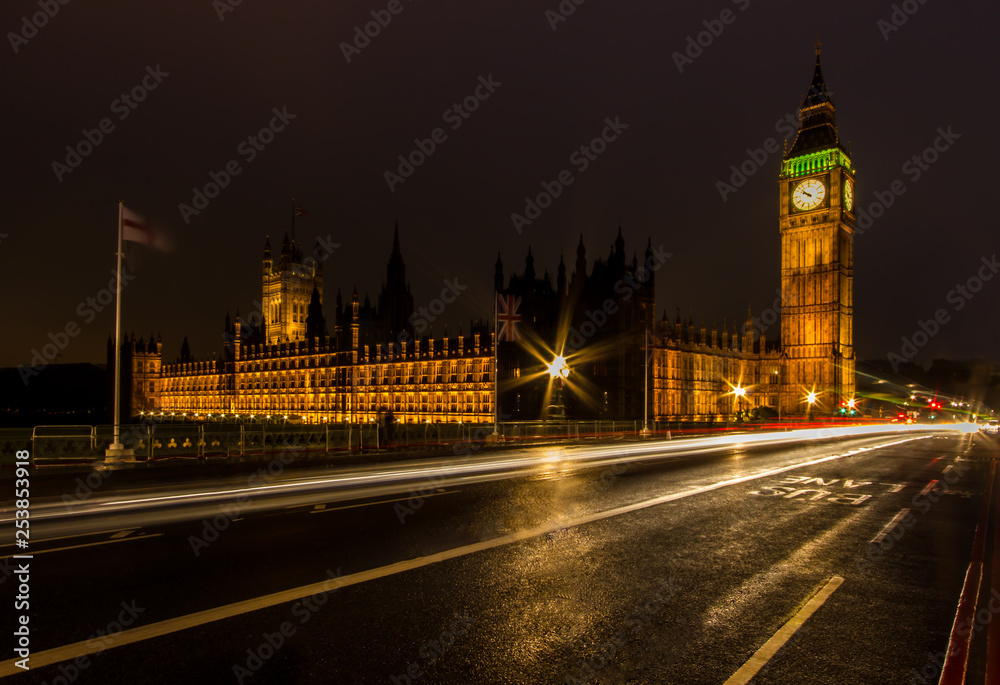 A night long exposure of the House of Parliament and Big Ben along the Westminster Bridge with traffic light trails A night long exposure of the House of Parliament and Big Ben along the Westminster Bridge with traffic light trails