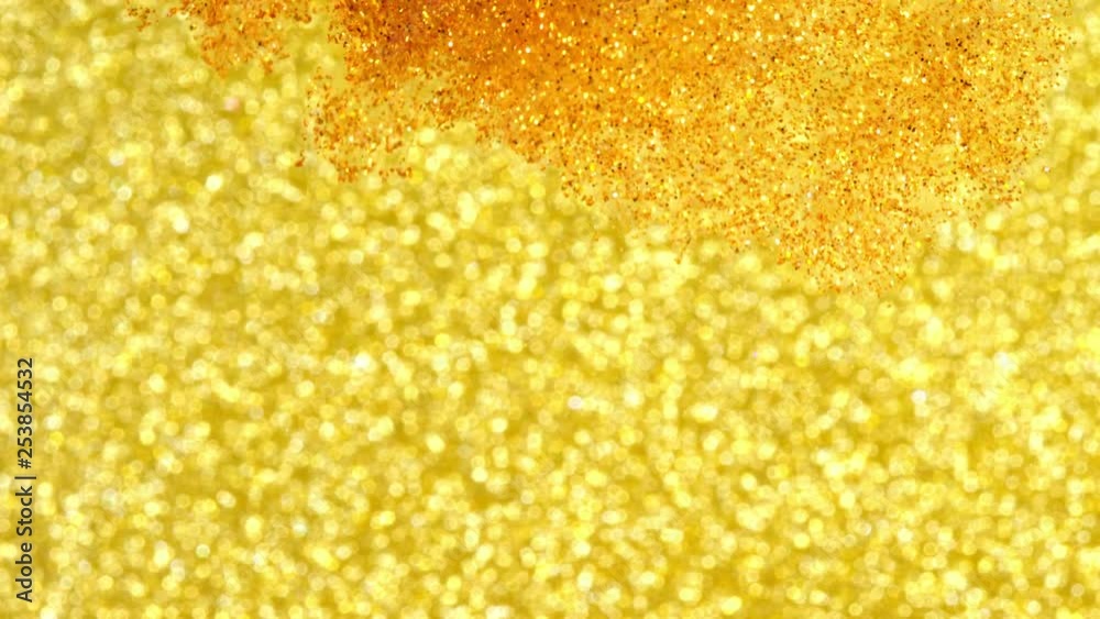 Glitter in water. Gold paint reacting in water creating abstract cloud formations.Can be used as transitions,added to modern projects,art backgrounds, anything with creative twist Glitter in water. Gold paint reacting in water creating abstract cloud formations.Can be used as transitions,added to modern projects,art backgrounds, anything with creative twist
