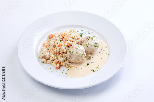 meatballs with barley on the white plate
