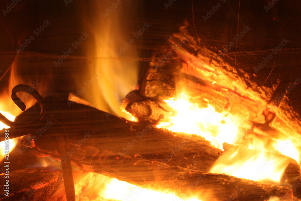 the crackling fire of a lit fireplace that recalls the winter Christmas atmosphere the crackling fire of a lit fireplace that recalls the winter Christmas atmosphere