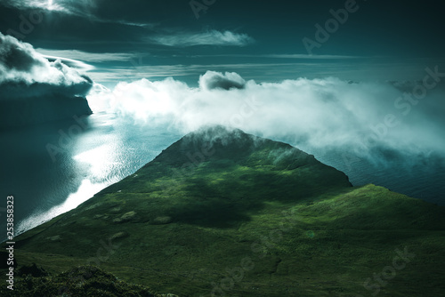 Hjornbarg cliff in moonlight, Iceland photo