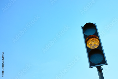 Yellow Traffic Light Against the Sky