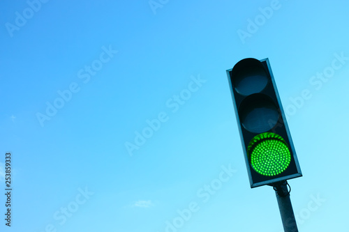 Green Traffic Light Against the Sky