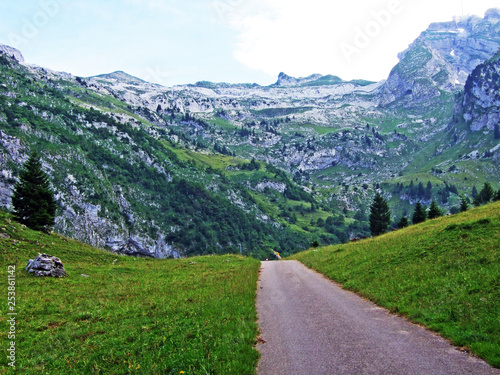 Alpine pastures and meadows on the slopes of Alpstein mountain range and in the river Thur valley - Cantons of St. Gallen and Appenzell Innerrhoden, Switzerland photo