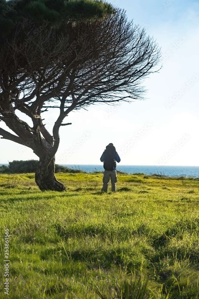 Hiker with backpack during hike Hiker with backpack during hike