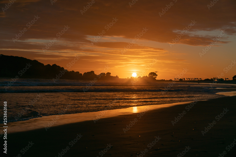 Golden sunrise over beach