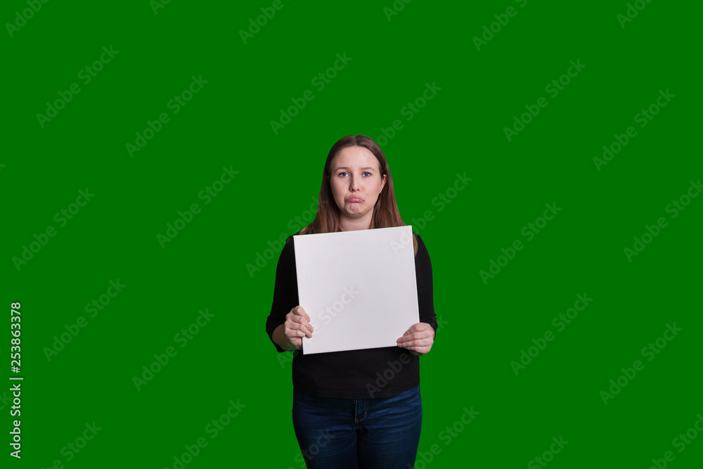 Young woman holding blank board sad frowning expression on her face green  screen portrait Stock Photo | Adobe Stock