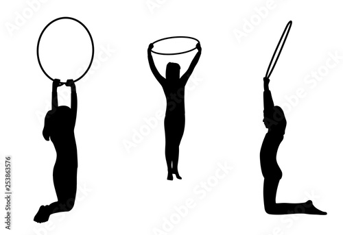 Gymnastic girls team performs with hoops