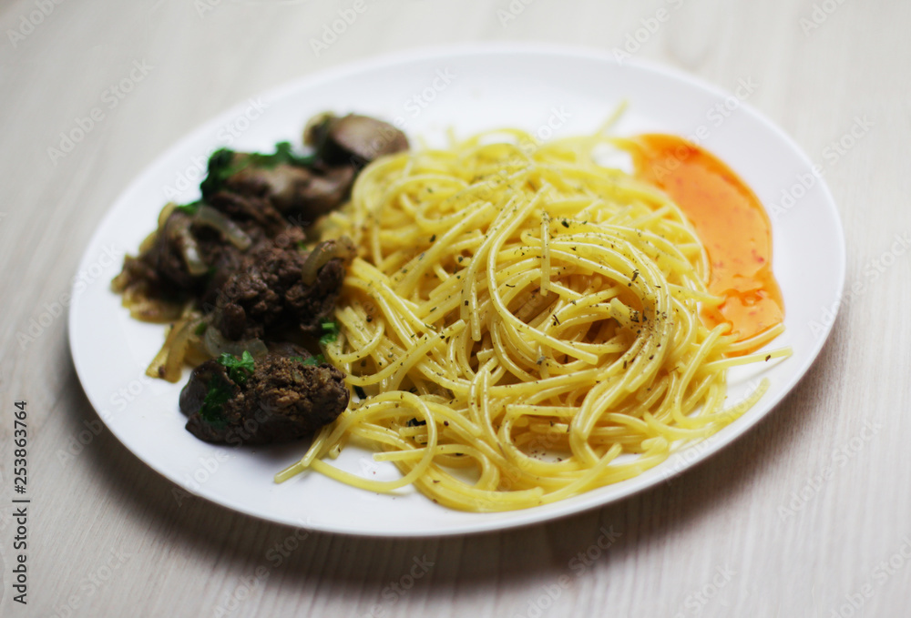 Pasta with fried liver and spacy sauce