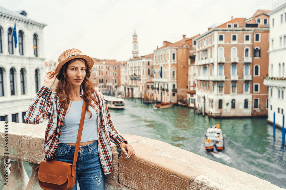 Obraz Woman in the Venice, standing on the bridge over the grand canal while on sightseeing in a foreign city. Discovery the Venice adventure.