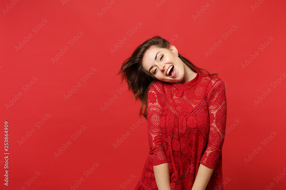Portrait of stunning cheerful young woman in lace dress keeping mouth open, looking camera isolated on bright red background in studio. People sincere emotions, lifestyle concept. Mock up copy space. Portrait of stunning cheerful young woman in lace dress keeping mouth open, looking camera isolated on bright red background in studio. People sincere emotions, lifestyle concept. Mock up copy space.