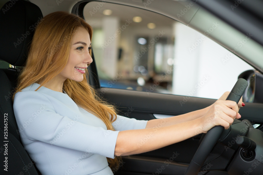 Attractive female customer at the car dealership Attractive female customer at the car dealership