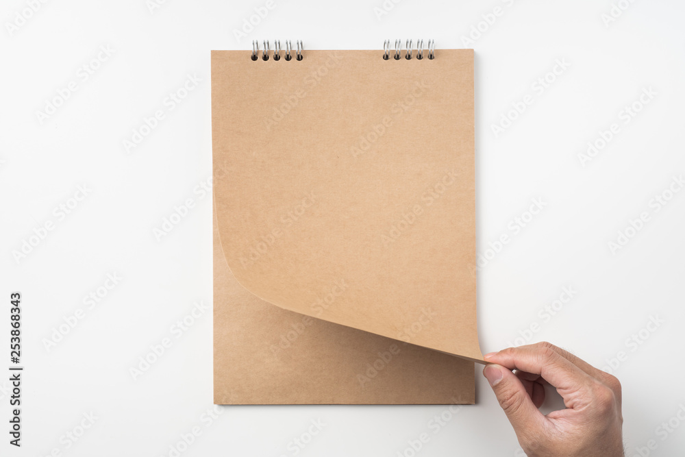 man's hand turn up kraft page on white man's hand turn up kraft page on white