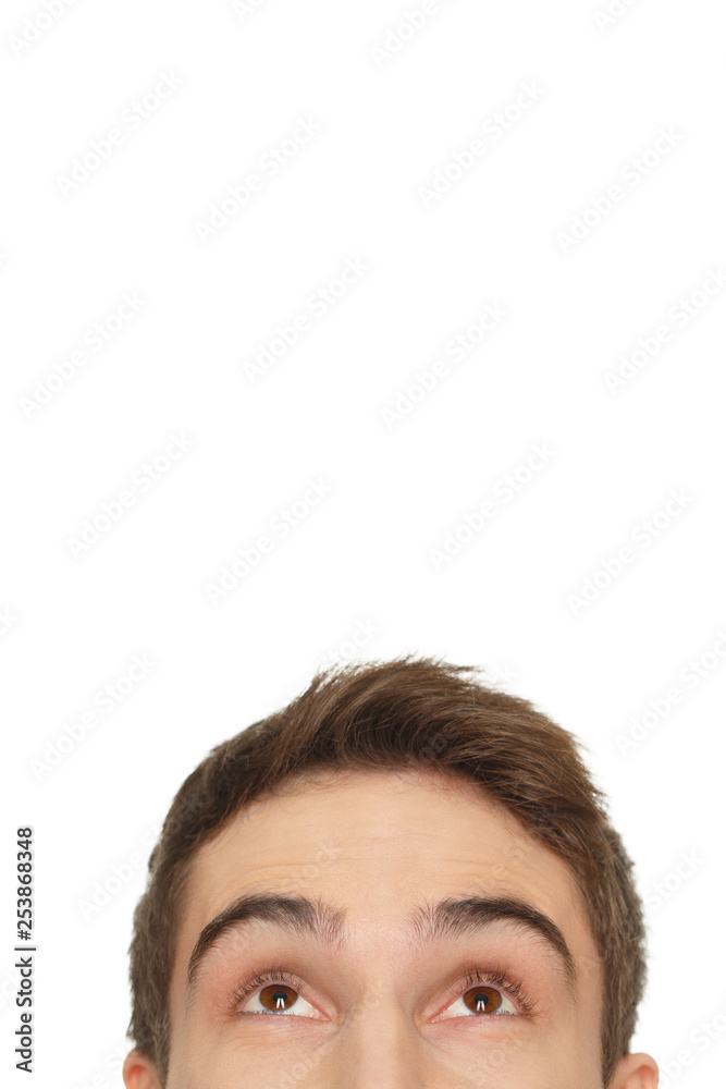 He is watching. Cropped closeup of a man looking up at the copyspace above him isolated on white He is watching. Cropped closeup of a man looking up at the copyspace above him isolated on white