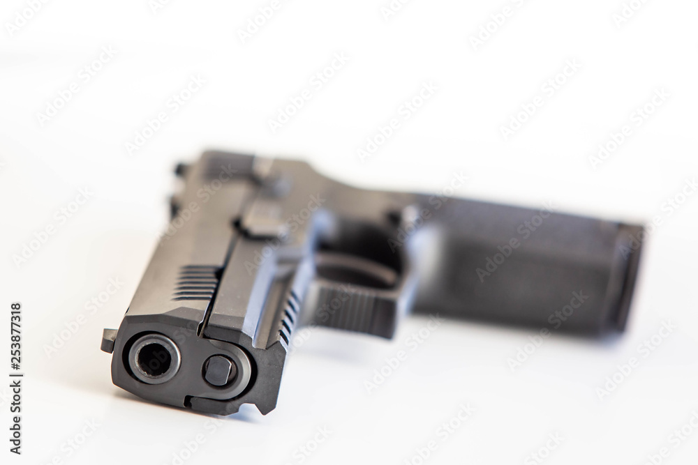Modern handgun white background isolated close up Modern handgun white background isolated close up