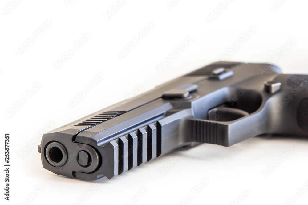Modern handgun white background isolated close up Modern handgun white background isolated close up